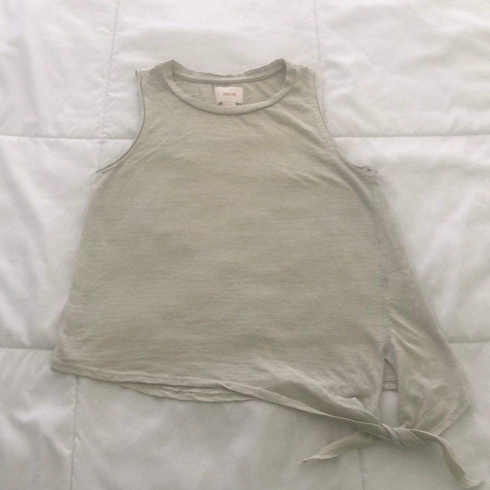 Maeve sleeveless tank in a light lime green with a side tie on the bottom